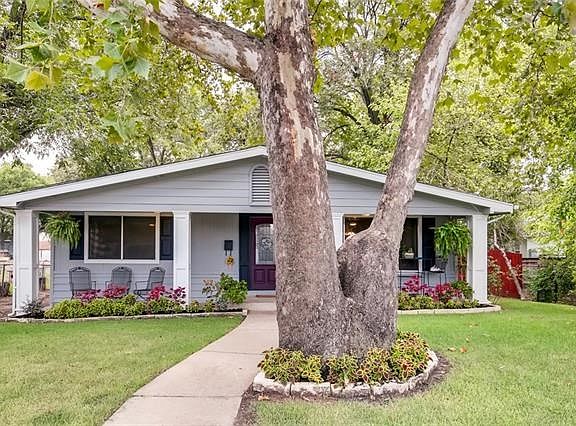 Pristine and showing off all its colorful landscaping.