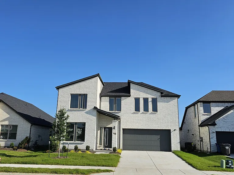 Welcome home to 907 Pink Skies Dr! This stunning, modern new-build features a sleek contemporary design with excellent curb appeal