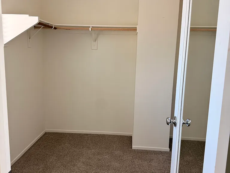 Primary bedroom spacious walk in closet.