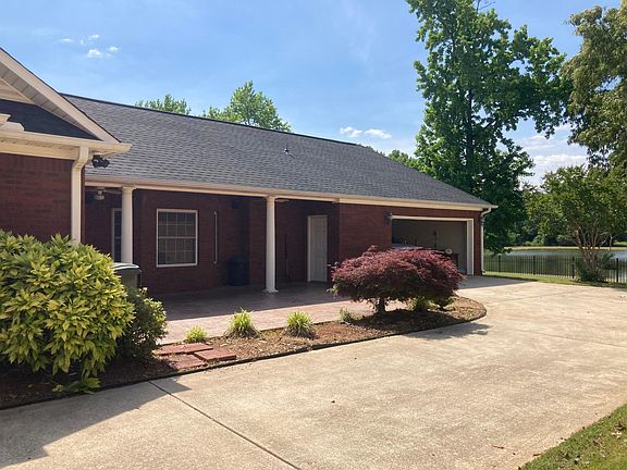Back patio and garage, waterfront in the back.