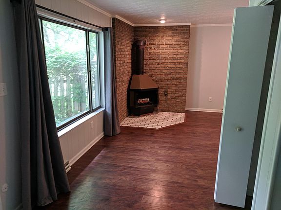 Wood-burning fireplace in family room