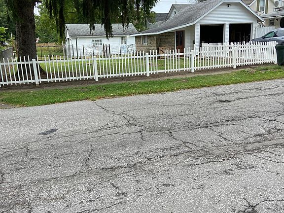 shows the white picket fence and largeyard