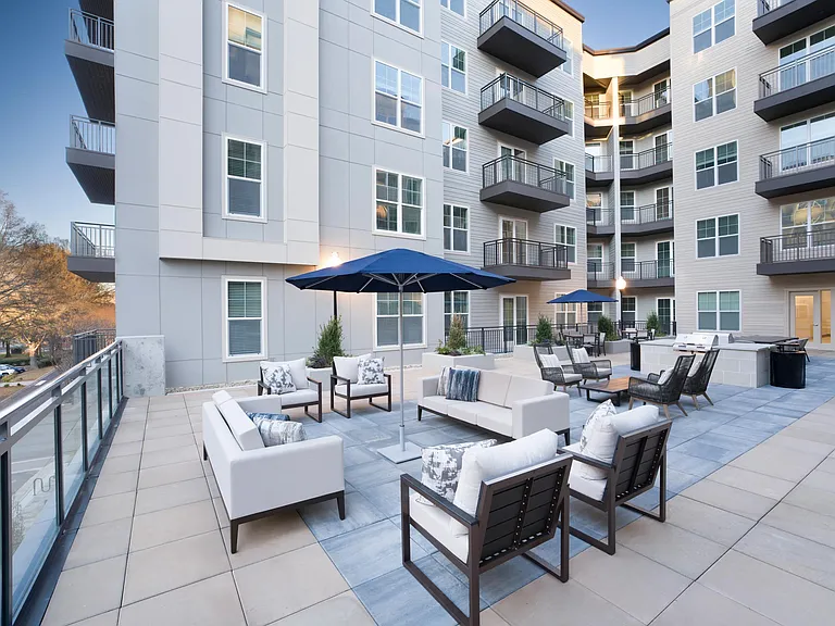 An elevated courtyard lounge at Modera Liberty Row offers comfortable seating and a polished outdoor retreat surrounded by modern apartment homes in Charlotte.