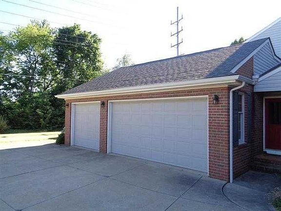 SIDE VIEW THREE CAR GARAGE