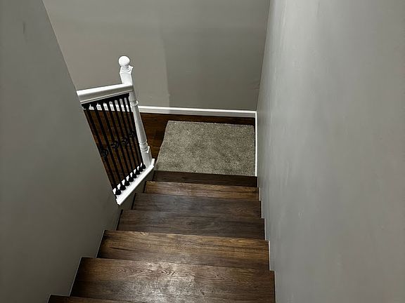 Staircase to upstairs bedrooms and bathrooms