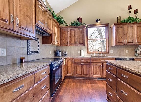 Granite, with Blanco tile back splash.