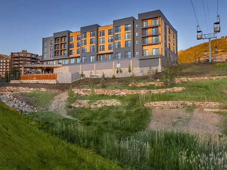 Canyon Haus exterior in the summer next to the Cabriolet lift
