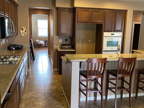 Bar Stools will remain in the home, Butler's pantry adjacent to kitchen