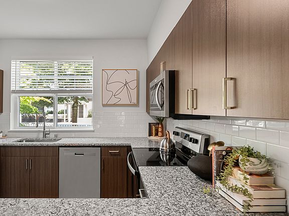 Modern open-concept layouts create a seamless flow between kitchen and living spaces