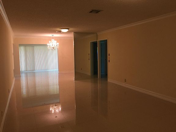 living area with beautiful tiled flooring throughout home