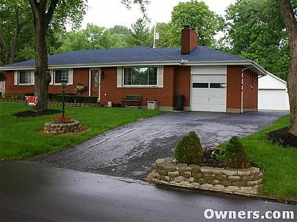 Front of House with detached garage in back