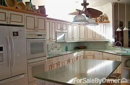 Designer Kitchen : Lots of built-in cabinets, counter tops and appliances, hardwood maple floors