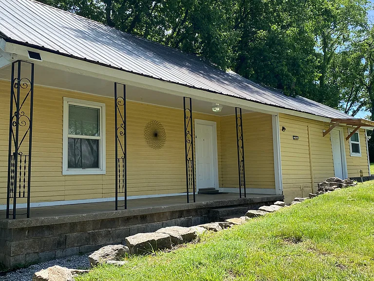 Plenty of space for an outdoor table and chairs on the porch to spend the evenings on.