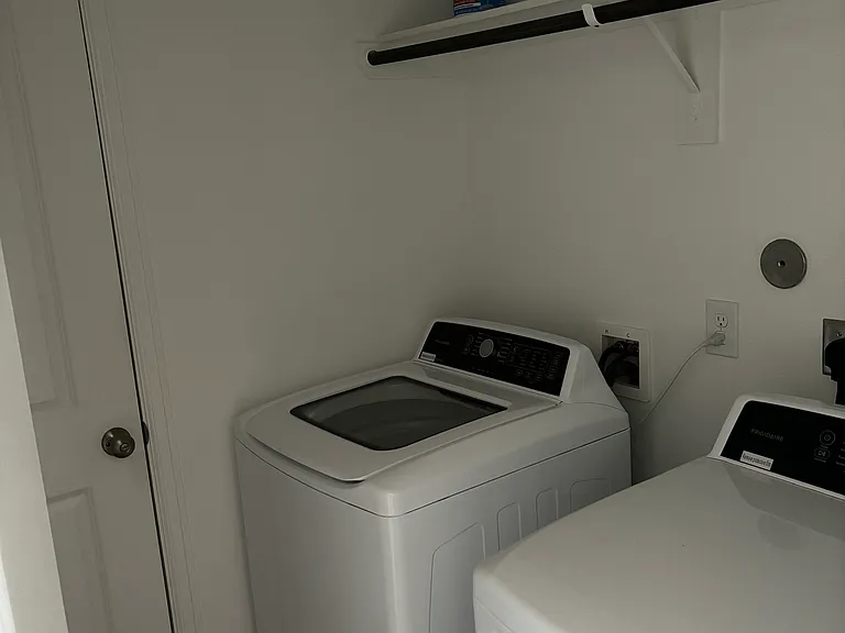 Laundry space between living room and garage