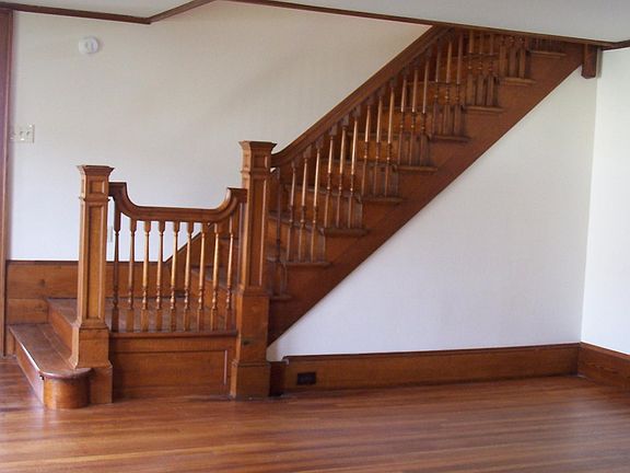 Staircase between the living room and second floor sitting r