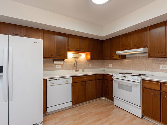 Sparkling clean kitchen with plenty of room for a table.