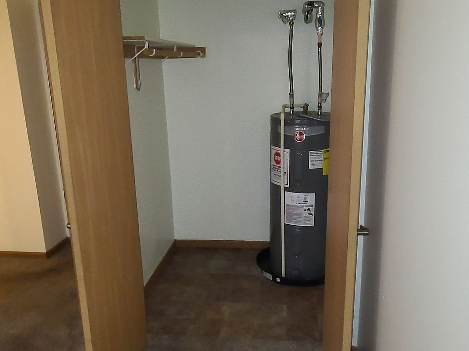 Back bedroom closet and hot water heater
