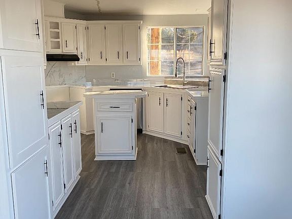 Kitchen has a beautiful view of the mountains. It has a brand new sink and faucet and plenty of cabinet space.