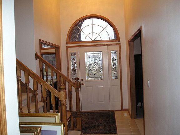 2-story entry with semi circular oak stairs