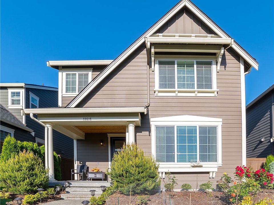 Delightful 2-story home with elegant covered front porch in Timber Creek community.