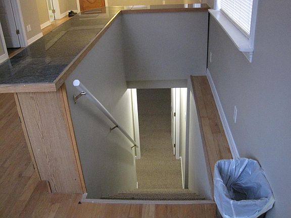 STAIRS TO BASEMENT AND 3RD. BEDROOM