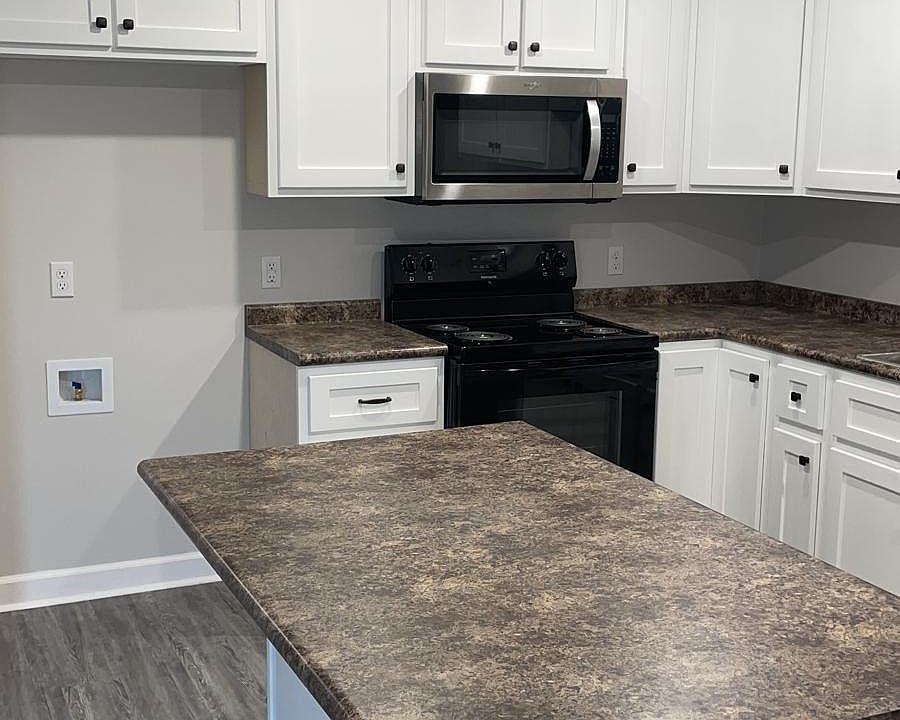Even though fridge is not shown in this photo, the house comes with a Refrigerator