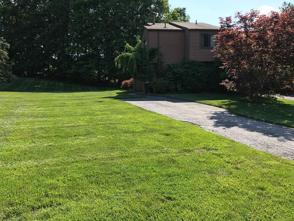 Large, flat property. Owner pays for landscaping. Trees around house have been removed or trimmed down since this photo.