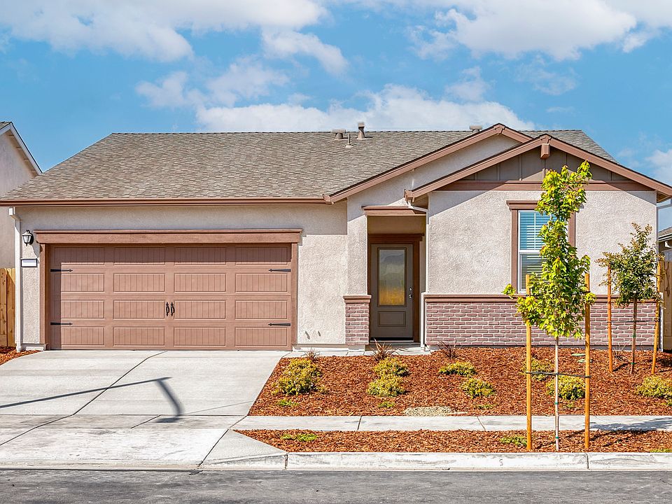 The Eureka is a single story home with stucco.