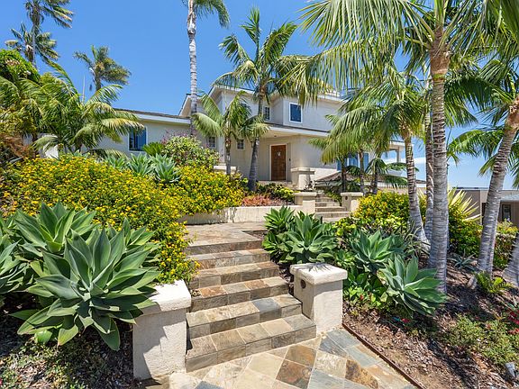 Front entrance and lush landscaping.