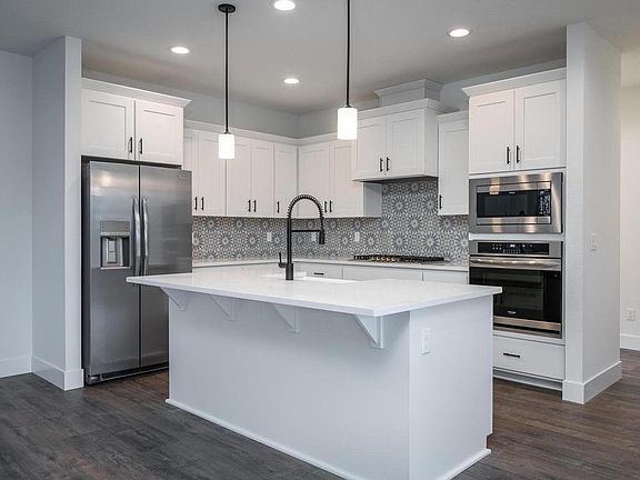 Gourmet kitchen. Touchless facet! Farmhouse style sink. Built in wall oven and microwave. Gas cooktop range.