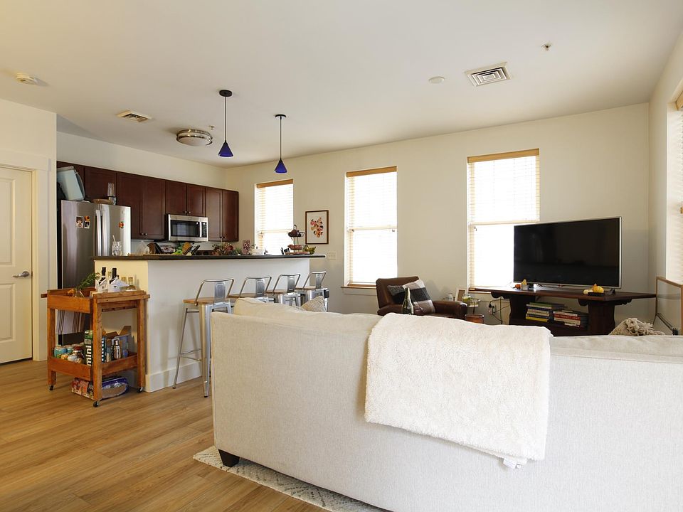 View of Living area with Kitchen in background