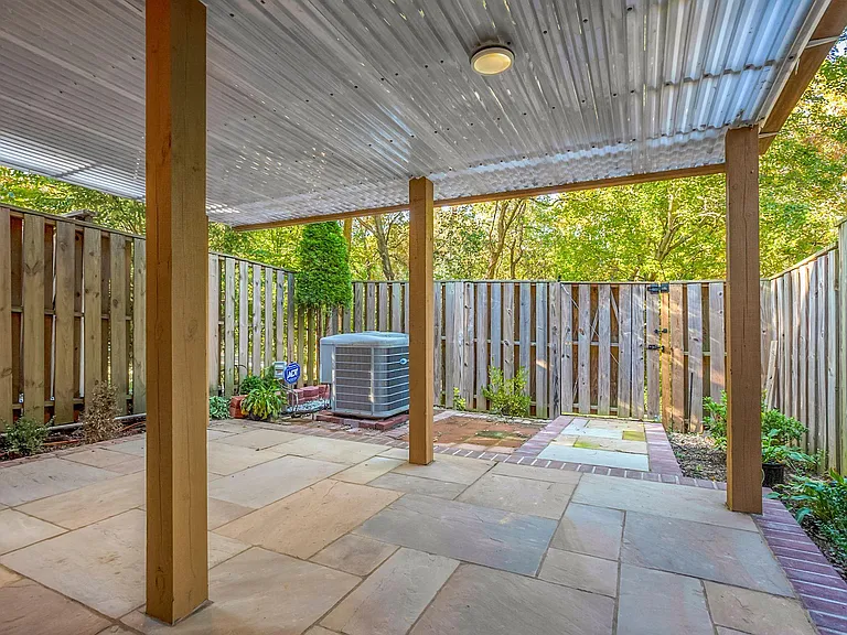 Flagstone patio in the backyard. Rain-free and maintenance free.