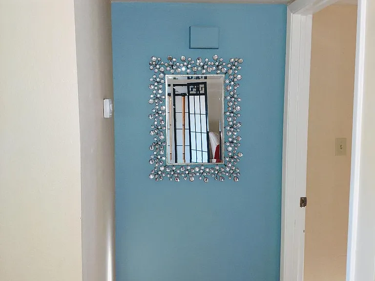 split floor plan with one bed and bath on either side of the great room