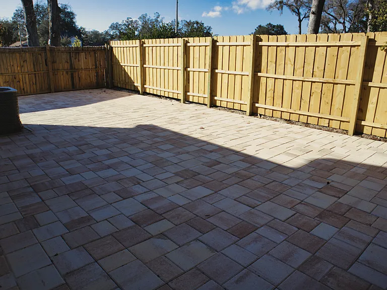 Fenced in Backyard area with pavers.