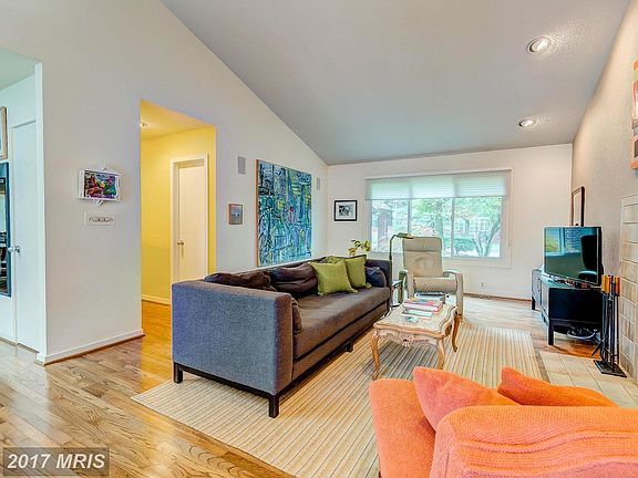 family room w vaulted ceilings and fireplace