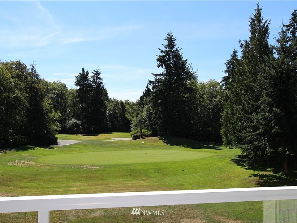 Perfectly located with this view of the First Green from your covered private deck.