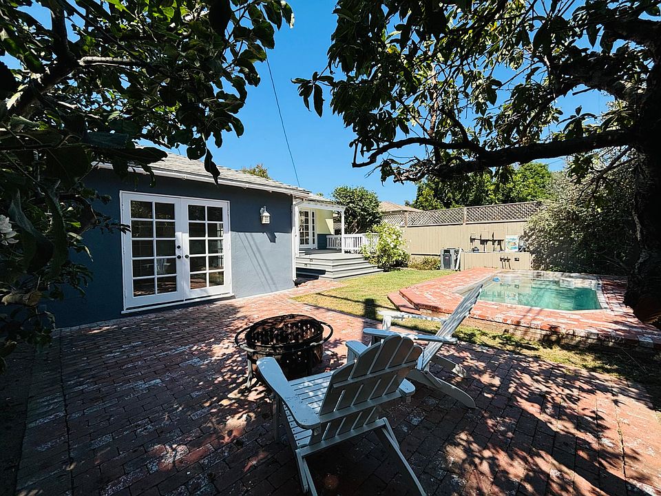 The garden hosts shade by the mature peach and apple trees, a lap pool with brick patio, a deck off the Master, a redbrick patio for entertaining. The Adirondacks and firepit come with the rental if desired. This yard is a private, peaceful hidden oasis.
