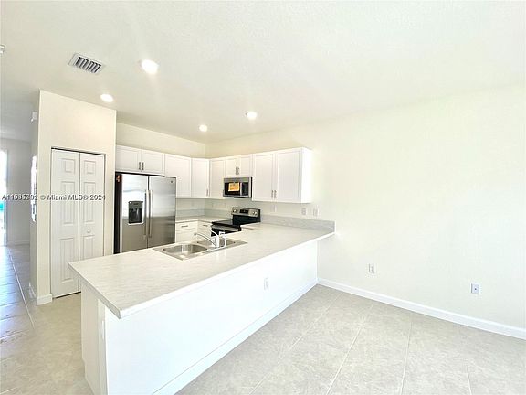 3rd image of 11046 W 32nd Ln #11046