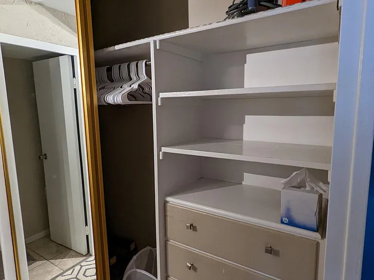 Plenty of storage with double-door mirrors, shelves, drawers.