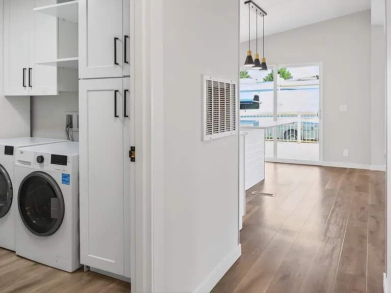 Laundry Room with Full-Size Washer & Dryer, Upper Cabinets, and Exterior Door and Exterior Back Door