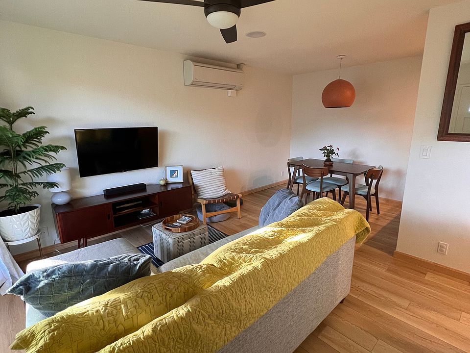 Walking into the unit, natural light illuminates the living and dining room areas.