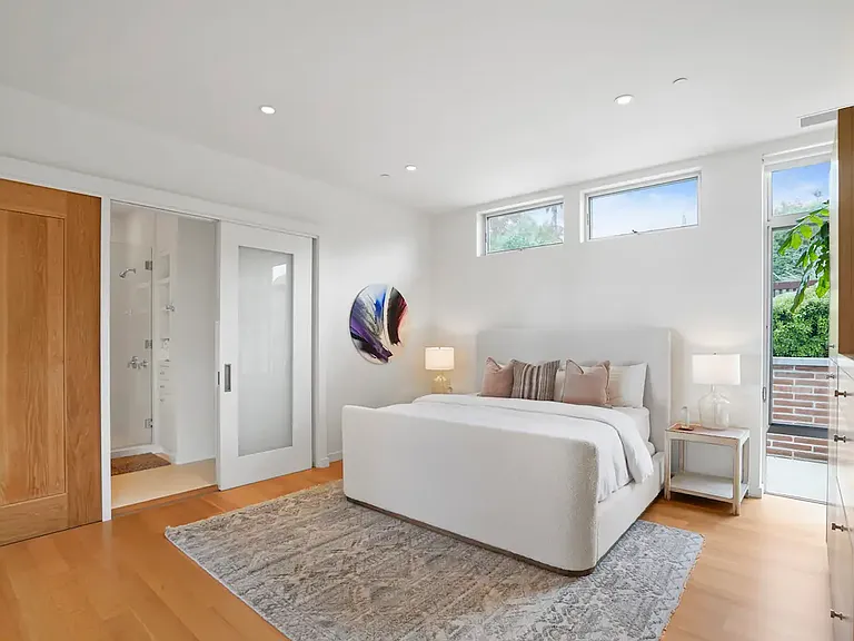Guest bedroom boasts a luxurious ambiance with elegant decor and upscale furnishings.
