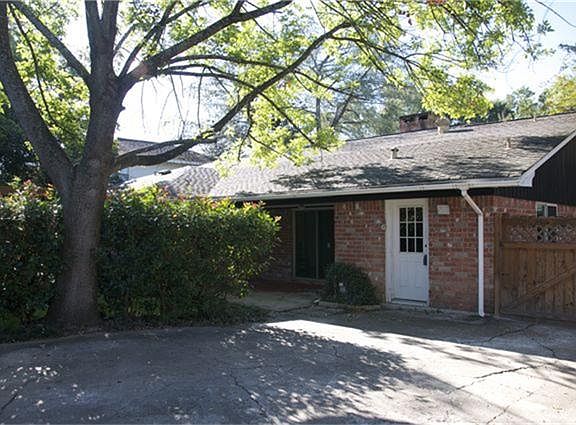 Large parking area behind the driveway gate.