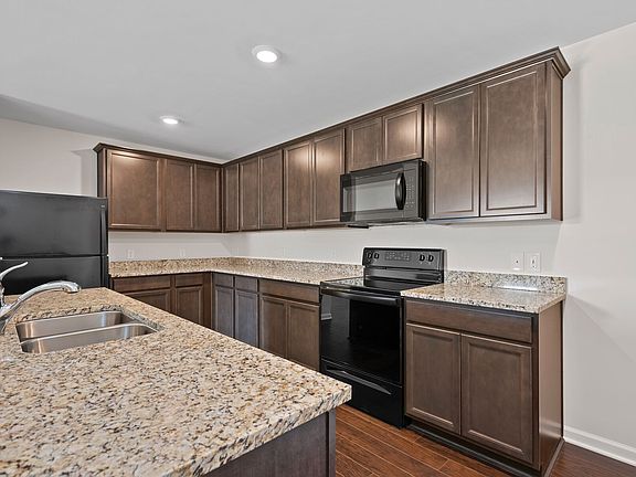 The kitchen comes with a full suite of energy-efficient appliances