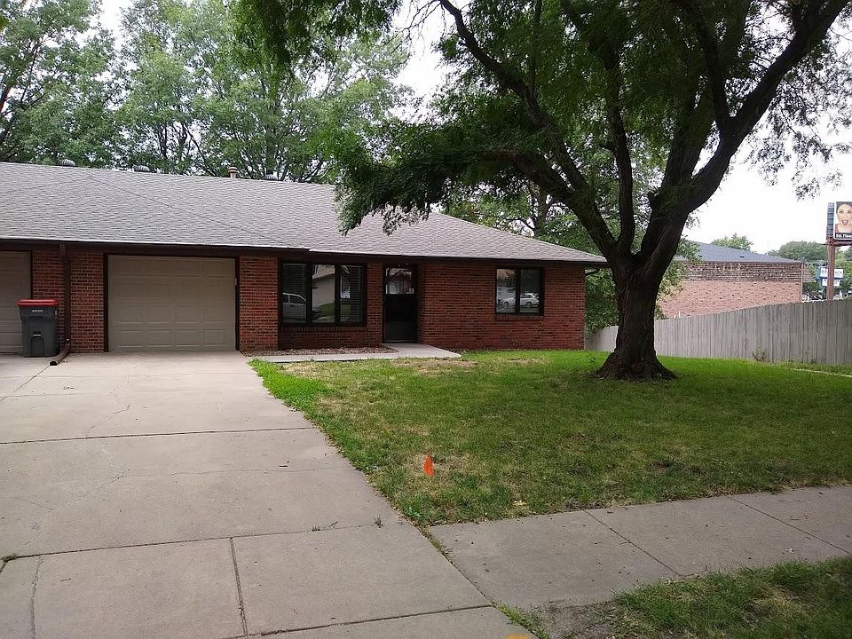 Townhouse view of unit and driveway from street.