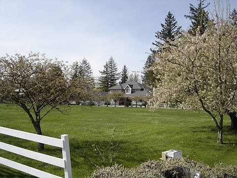 Home is set back off the road with this beautifully fenced pasture