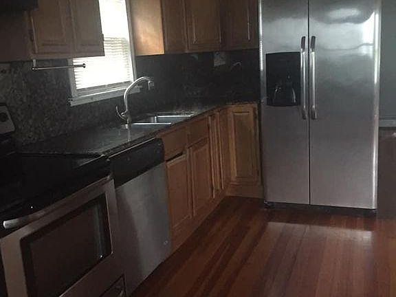 updated kitchen with stainless steel appliances, granite counter tops, pantry for extra storage