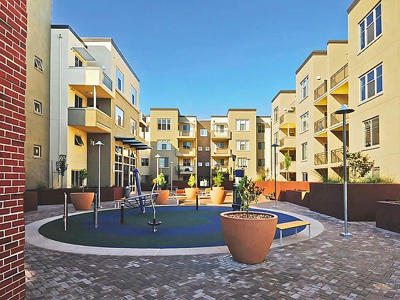 Play, relax, and connect in this vibrant courtyard surrounded by modern living.