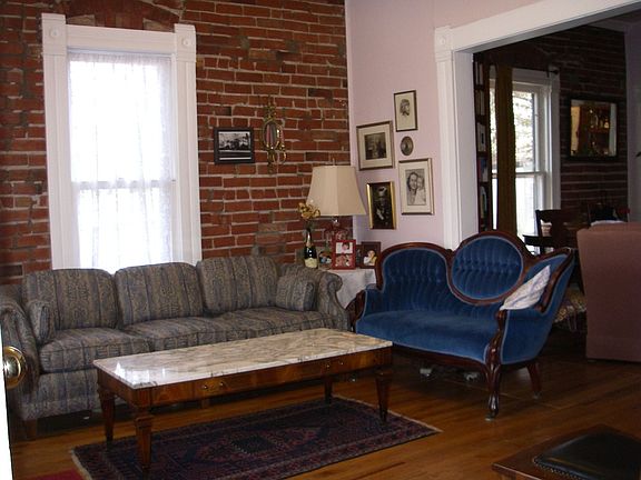 living room w/exposed brick