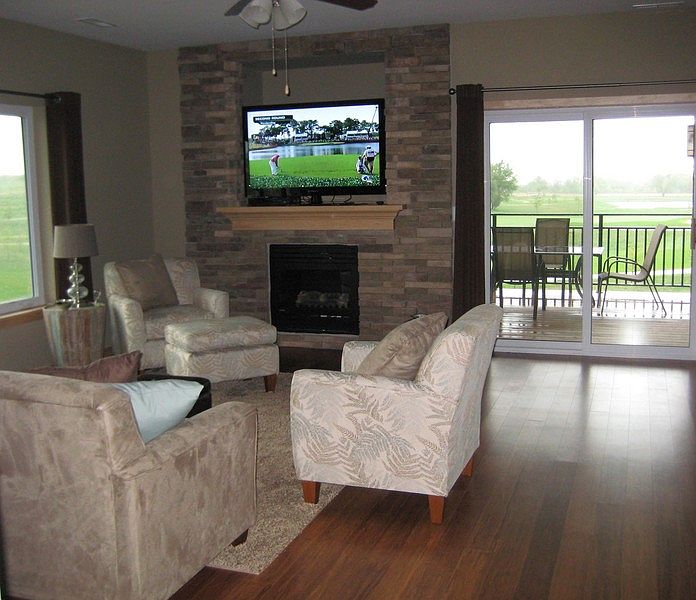 Open Concept Living
						:
						Stone fireplace wall